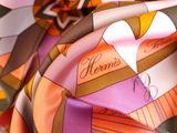 a close up of a colorful scarf with a name on it