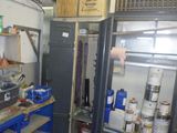 a room that has a bunch of items on the shelves