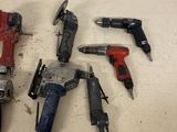 a lot of tools that are laying out on the floor
