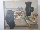 a painting on a easel with a plate of food on it