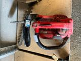 a picture of a drill and a hammer on a piece of wood