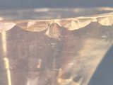 a close up of a clear glass bowl on a table