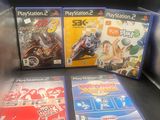 trois jeux vidéo posés sur la table, dans la boîte