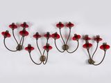 a set of four red glass and brass wall lights