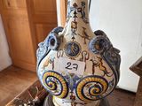 a vase that is sitting on top of a wooden table