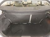 a trunk of a car with the back seats folded down