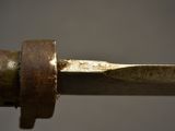 a close up of a metal object with a ring on it