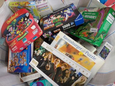 a pile of children ' s toys and games in a basket