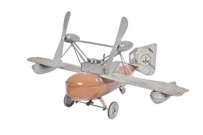 a small model of a plane with propellers on a white background