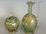 three glass vases sitting next to each other on a table