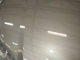 a reflection of a car in a mirror on the side of the car