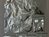 a lot of items in the bags on the table