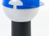 a blue and white lamp on top of a black stand