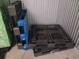 a stack of pallets sitting in a storage room