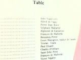 a menu for a restaurant with a pink table cloth
