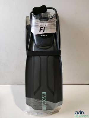 a close up of a black and gray water bottle on a table