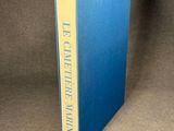 an image of a blue book with a yellow strip on the cover