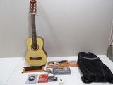 a guitar and other musical items on a table