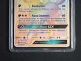 a close up of a pokemon card in a plastic case