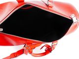 a red handbag with a zipper on the inside of it