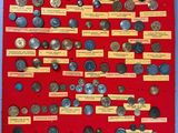 a red display board with a bunch of coins on it