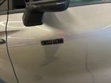 a close up of a car door with a sticker on it