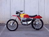 a red and yellow motorcycle parked in a parking lot