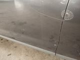 a close up of a car door with a hole in the side