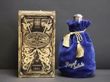 an image of a bottle of perfume sitting next to a box
