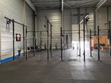 an image of a gym area with a crossfit station