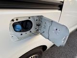 a white van with an electric plugged in it