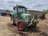 a tractor that is sitting in the dirt