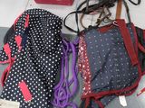 a bag and a backpack on the floor next to other items