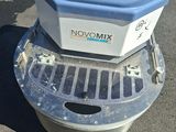 a small blue machine that is sitting on the ground