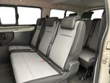 two seats in the back of a van that is empty