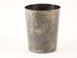 a metal cup that has a shield on it