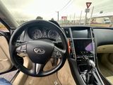 a steering wheel and dashboard of a car on the road