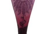 a purple vase with a black base on a white background