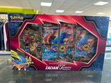 display of pokemon cards in a store display case on a glass table