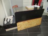 a table with a glove on top of it in a room