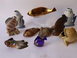 a lot of figurines that are sitting on a table