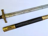 two different types of swords are displayed on a white surface