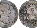 a close up of a coin with a crown on top of it