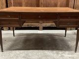 a wooden desk with two drawers and a drawer underneath it