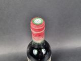 a bottle of wine that is sitting on a table