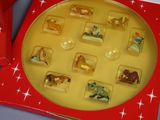 an image of a red box with a collection of animal figurines in it