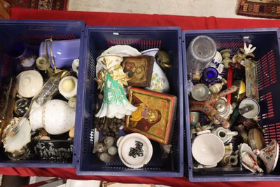 two bins filled with assorted items sitting on a table