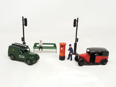 a small toy car and a small toy car next to a bench
