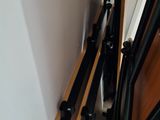 a bunch of black and white skis hanging on the wall