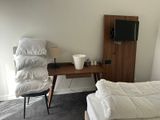 a bed and a desk in a small room